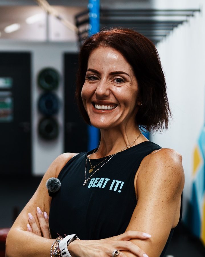Diandra, the head coach, smiling in a black Beat It top