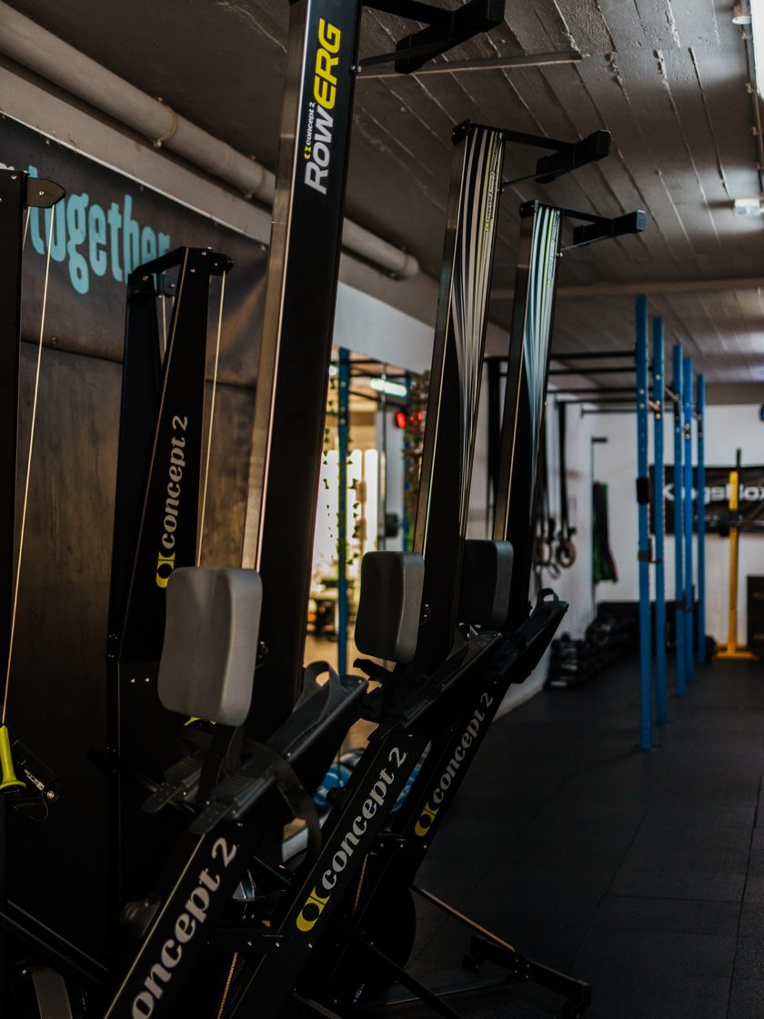 A row of Concept2 rowers and ski ergs on the top-floor gym